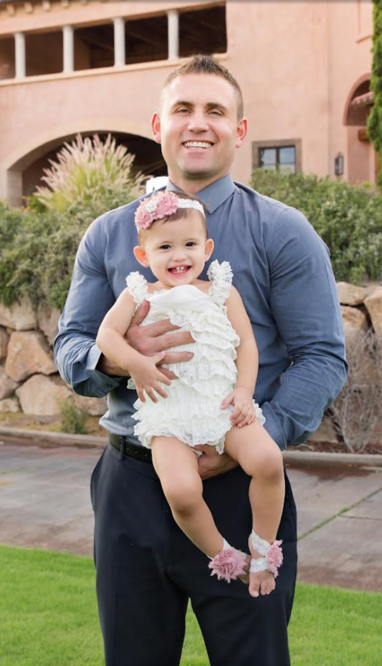 Matt Shiel holding his daughter, Zara